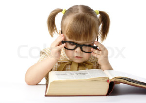 Cute little girl reading book, back to school